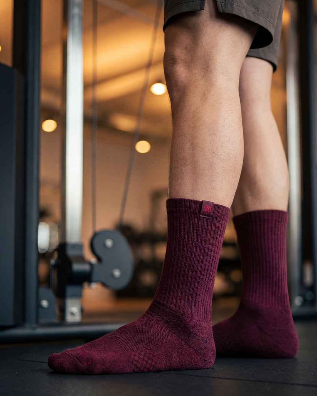 Bulg 788 C'est la Vie crew socks in athletic use with deep wine burgundy ribbed cushioning