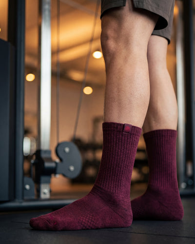 Bulg 788 C'est la Vie crew socks in athletic use with deep wine burgundy ribbed cushioning