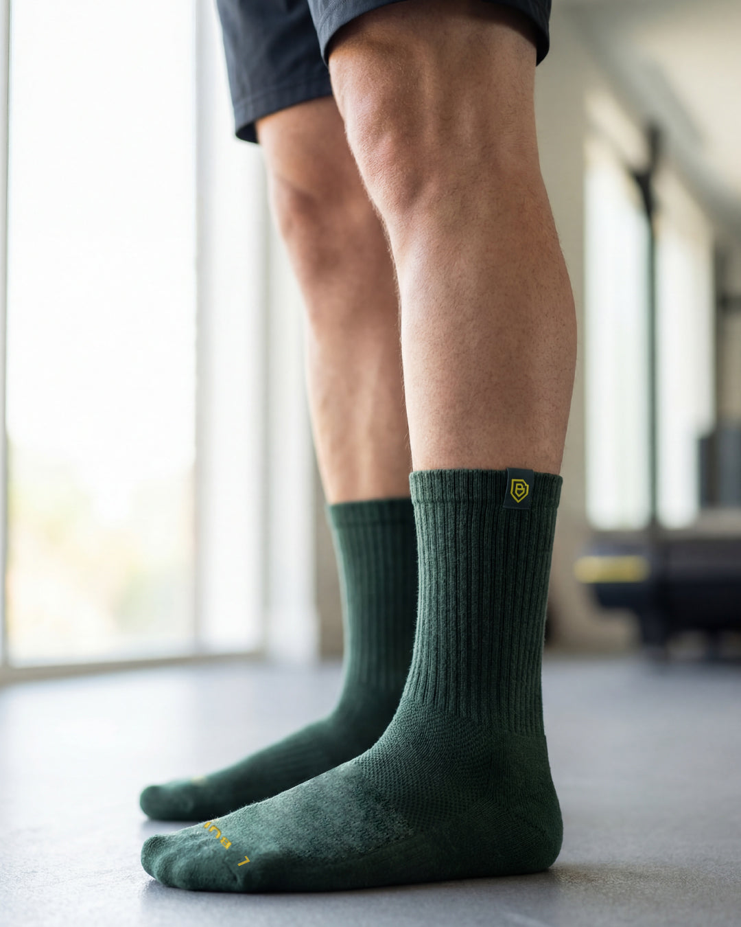 Bulg 788 Heritage Green crew socks in athletic use with deep pine ribbed cushioning