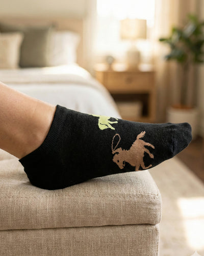 Socksop Cowboy ankle socks at home — black pair with western-themed indoor styling