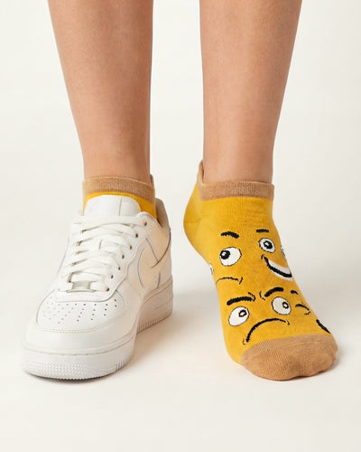 Socksop Emoji ankle socks studio shot — yellow pair with assorted smiley emoji faces