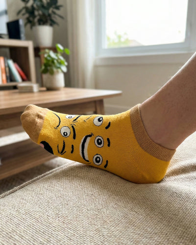 Socksop Emoji ankle socks at home — yellow pair styled with relaxed indoor cue