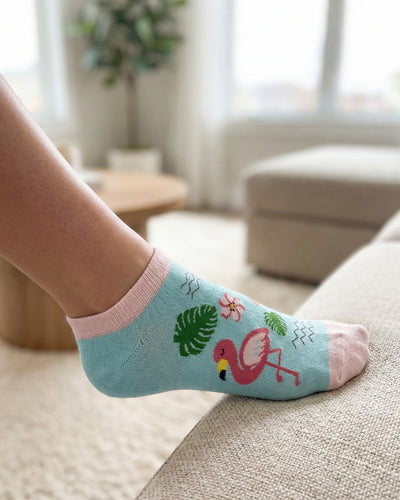 Socksop Flamingo ankle socks at home — turquoise pair styled with tropical indoor scene