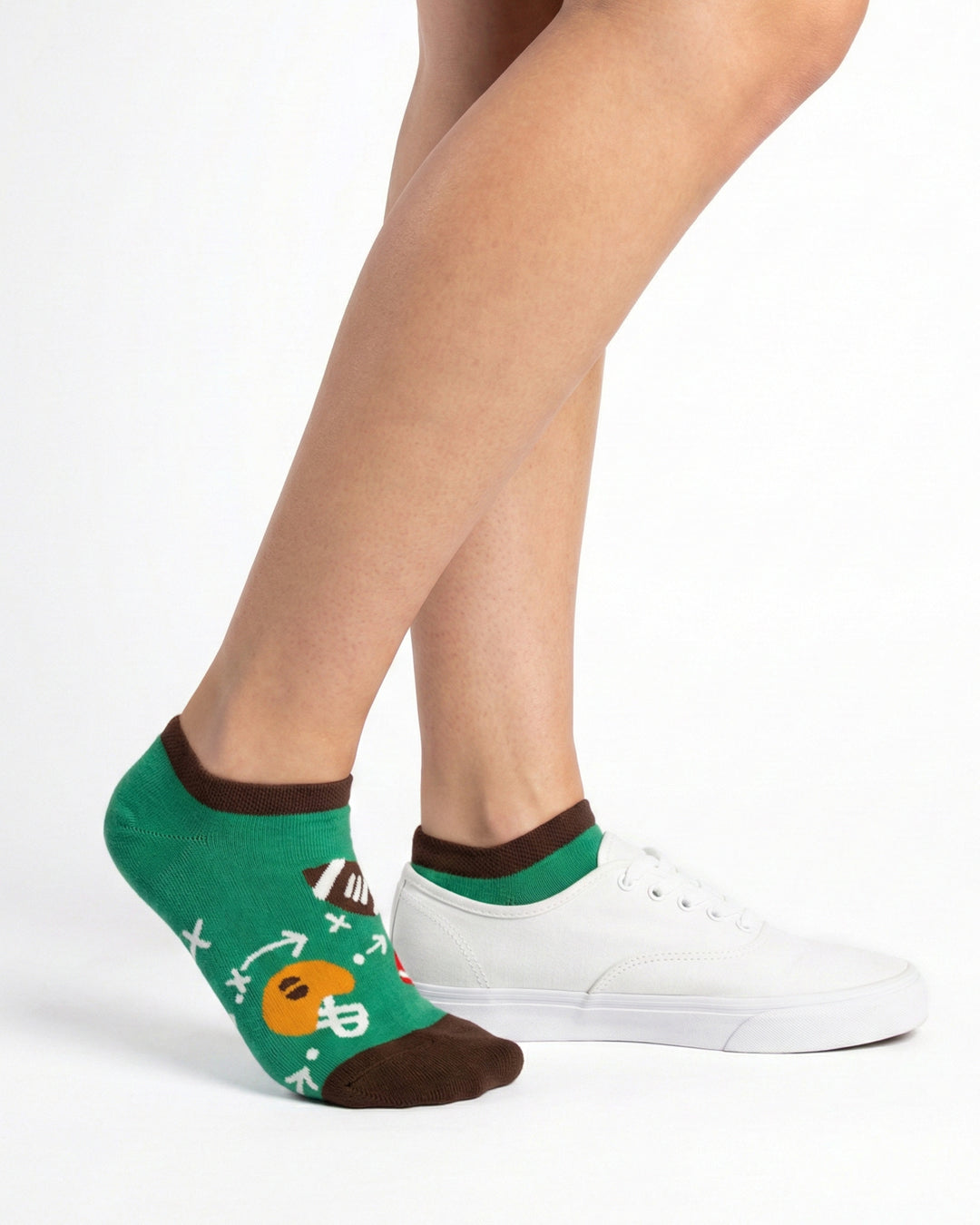 Socksop Football ankle socks studio shot — green pair with footballs helmets and chalkboard plays