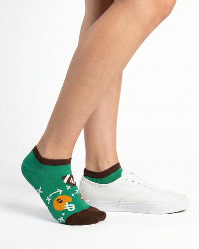 Socksop Football ankle socks studio shot — green pair with footballs helmets and chalkboard plays