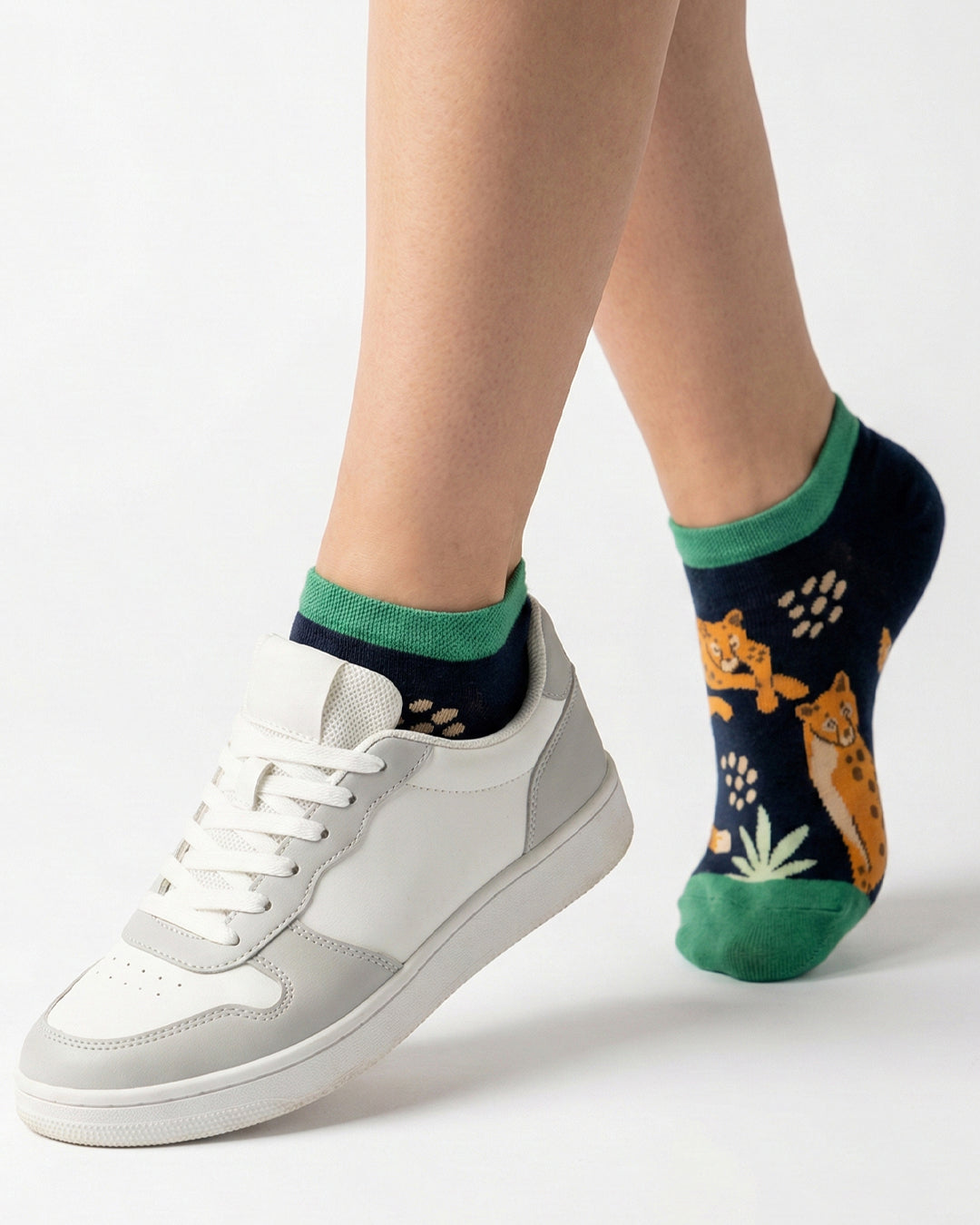Socksop Forest ankle socks studio shot — navy pair with orange leopards and fern fronds