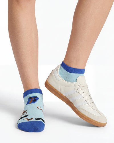 Socksop Gentleman ankle socks studio shot — light blue pair with mustaches bowler hats and monocles