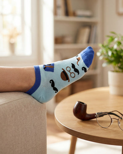 Socksop Gentleman ankle socks at home — light blue pair styled with dapper indoor scene