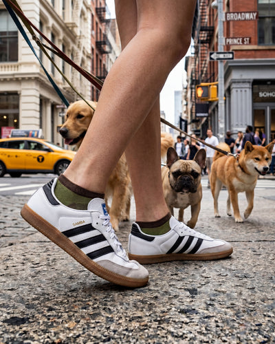 Socksop Paw ankle socks lifestyle shot — olive pair styled with playful pet-owner outfit