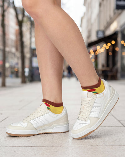 Socksop Pizza ankle socks worn outdoors with low-cut shoes — pizzeria-bound street style