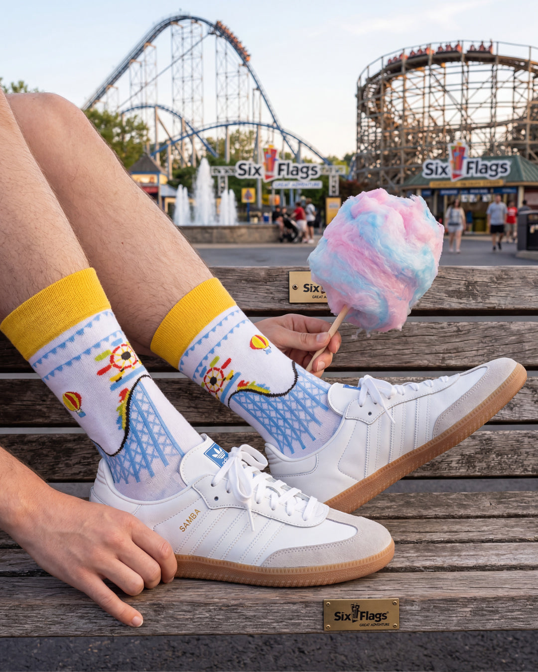 Socksop Amusement Park crew socks worn outdoors — fairground-themed pattern paired with sneakers