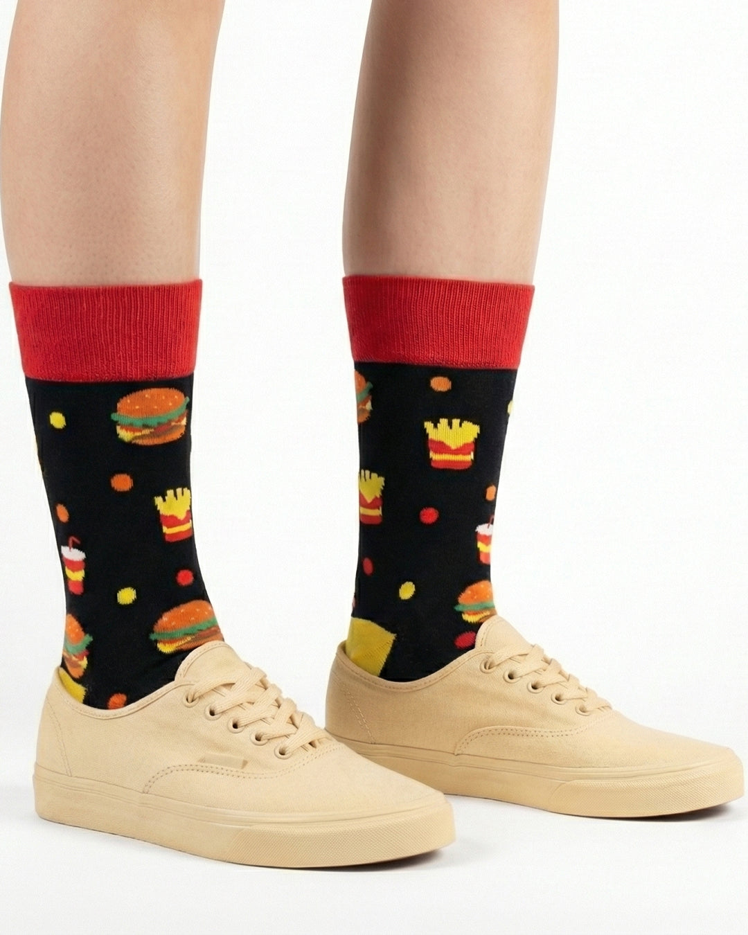 Socksop Burger crew socks studio shot — fast-food motifs in red yellow and orange on black