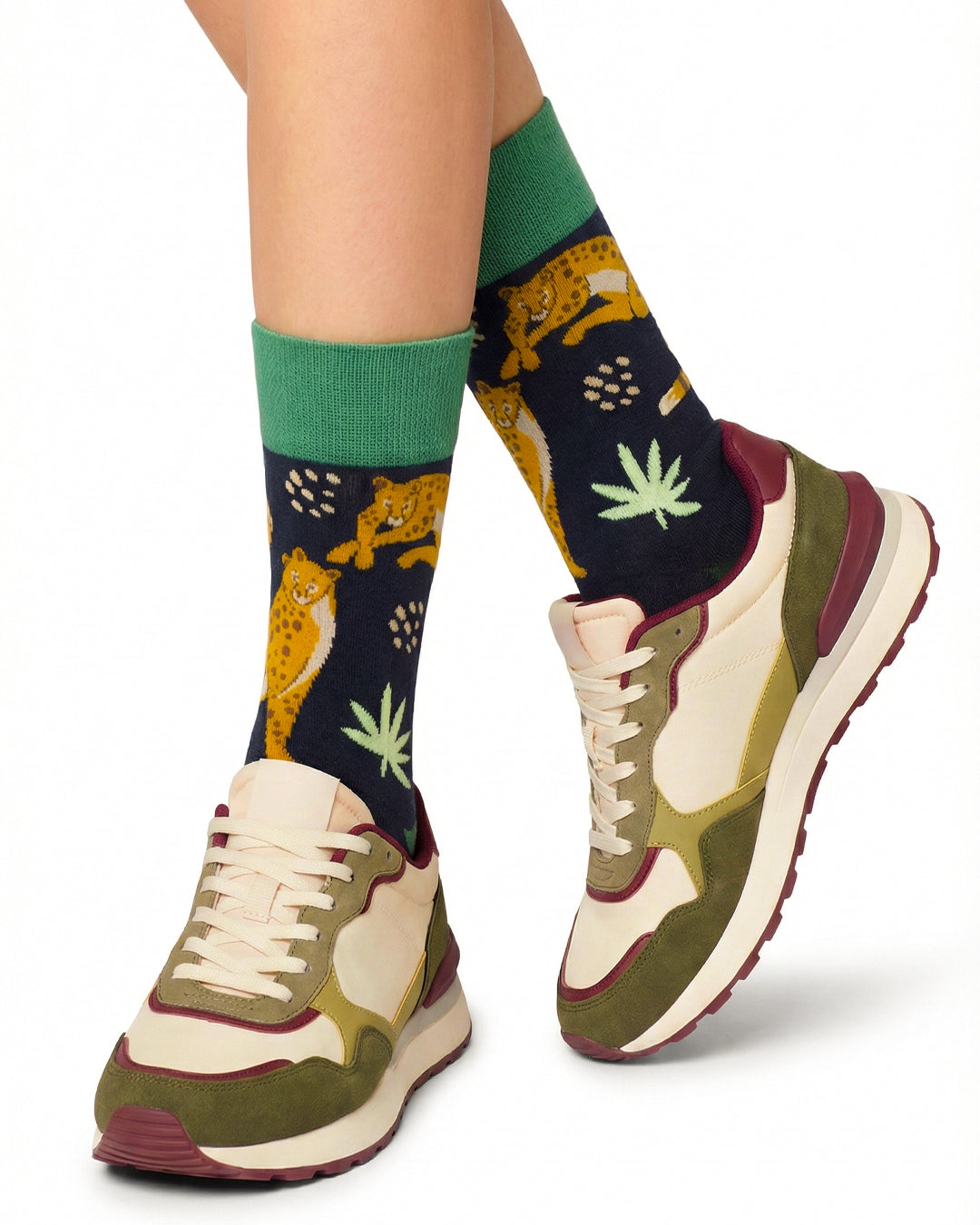 Socksop Forest crew socks studio shot — jungle leopard and foliage motifs on black cotton
