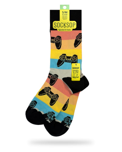 Socksop Gamer crew socks — studio hero shot with game controllers on retro pastel rainbow stripes
