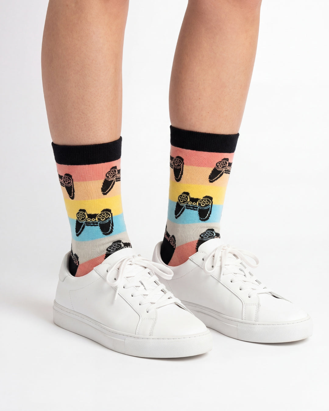 Socksop Gamer crew socks studio shot — controller motifs on pastel rainbow stripes