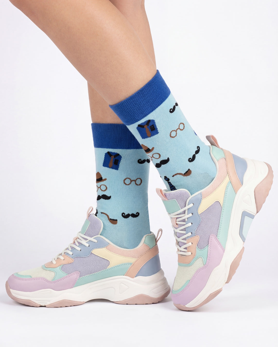 Socksop Gentleman crew socks studio shot — light blue with mustache pipe and bowler hat icons