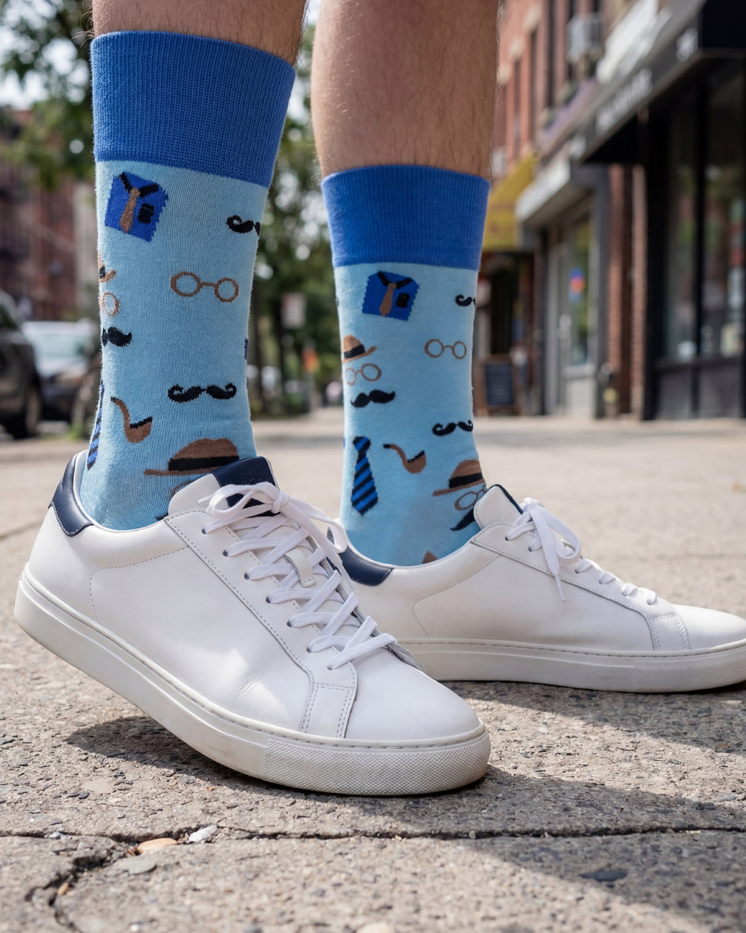 Socksop Gentleman crew socks worn outdoors — vintage gentleman icons in light blue