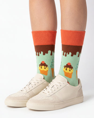 Socksop Ice Cream crew socks studio shot — mint green with cupcake and chocolate drip motifs