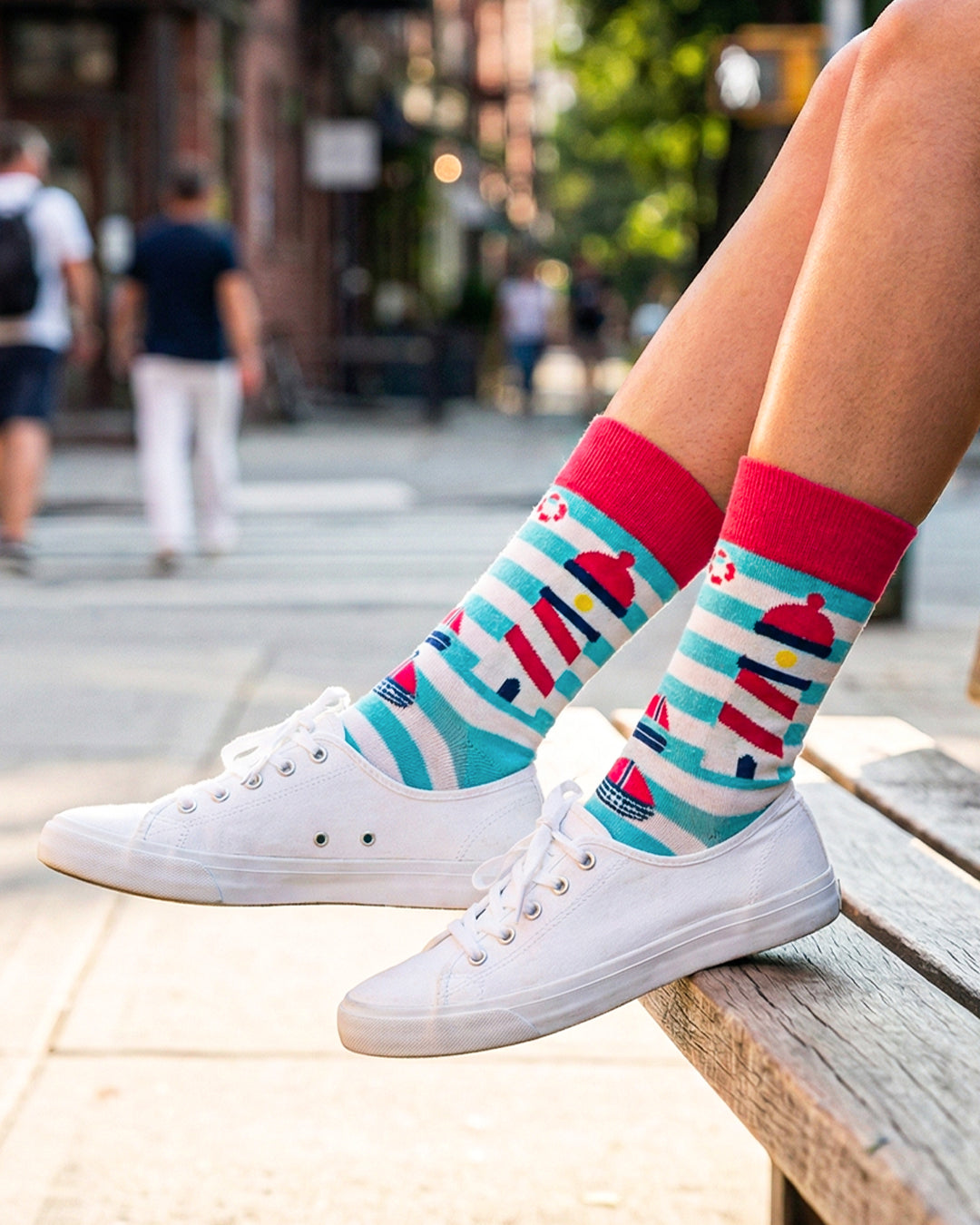 Socksop Lighthouse crew socks worn outdoors — nautical lighthouse pattern by the sea