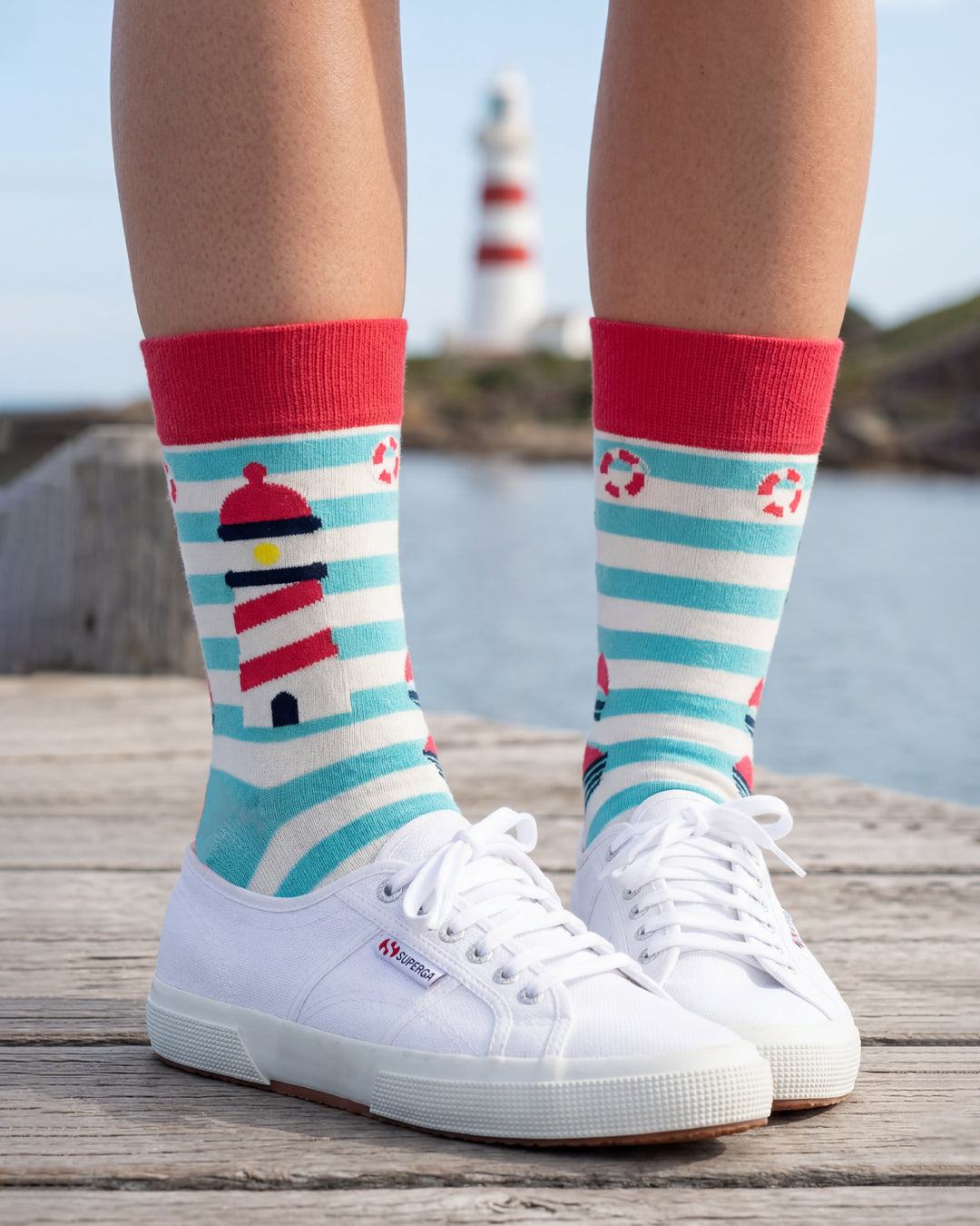 Socksop Lighthouse crew socks lifestyle shot — turquoise stripes styled with seaside outfit