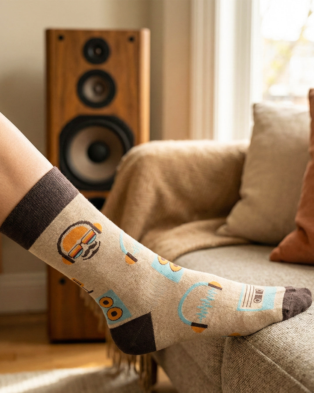 Socksop Music crew socks at home — retro audio print styled for relaxed lounging