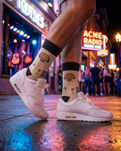 Socksop Music crew socks worn outdoors — DJ and headphones pattern in everyday wear