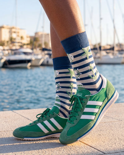 Socksop Nautical crew socks worn outdoors — maritime stripe pattern in seaside setting