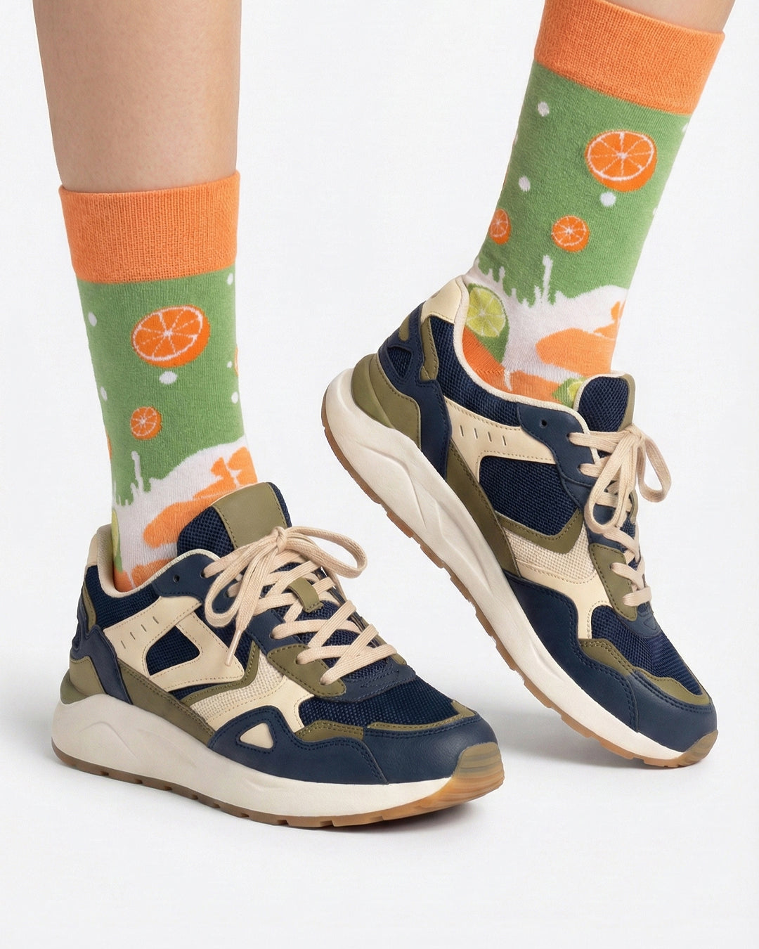 Socksop Orange and Lime crew socks studio shot — citrus split with orange and lime slice icons