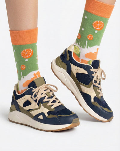 Socksop Orange and Lime crew socks studio shot — citrus split with orange and lime slice icons