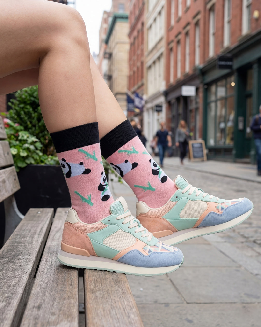 Socksop Panda crew socks worn outdoors — playful panda and bamboo pattern