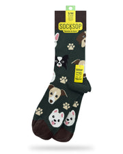 Socksop Paw crew socks — studio hero shot dark green with dog faces and tan paw prints