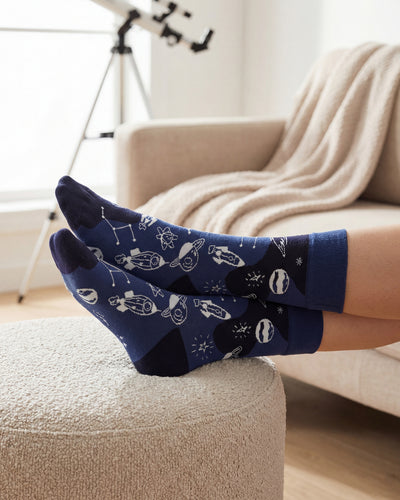 Socksop Space crew socks at home — cosmic rocket print styled for cozy indoor wear
