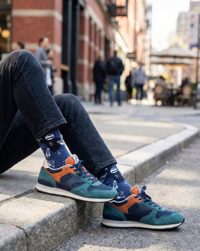 Socksop Space crew socks worn outdoors — outer space pattern in everyday setting