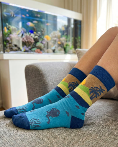 Socksop Summer crew socks at home — vacation sunset print styled for relaxed lounging