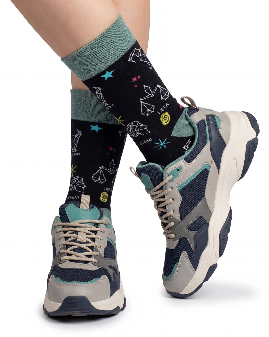 Socksop Zodiac Signs crew socks studio shot — black with white constellation and astrology motifs